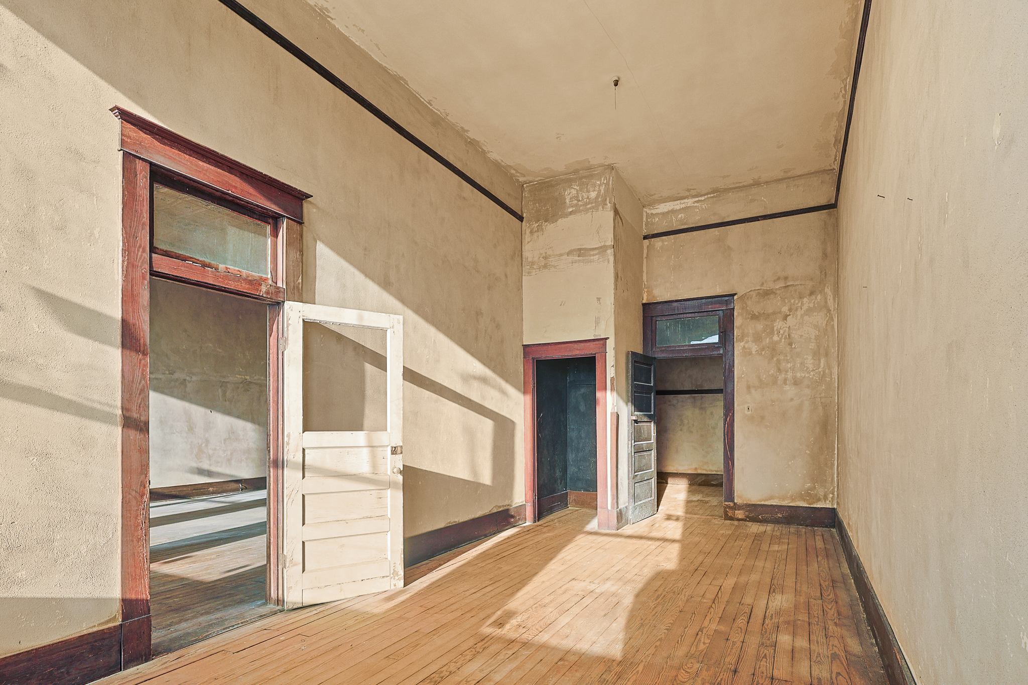 Open ground-floor commercial shell space with tall ceilings